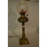 Brass oil lamp with chimney and shade converted for use with electricity