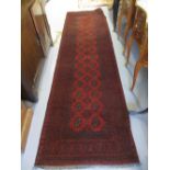 Modern red ground Afghan runner, 2.86m x 0.78m