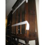 Mid 20th Century oak bookcase with two bar glazed doors on low baluster turned supports
