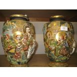 Pair of large Satsuma baluster form vases decorated with figures and elephants having character