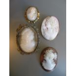 Four various 19th Century shell carved cameo brooches together with a similar 20th Century brooch