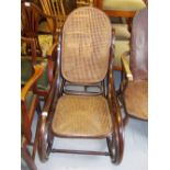 Bentwood rocking chair with caned back and seat