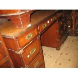 Reproduction mahogany military style twin pedestal desk, the leather inset top above nine drawers