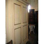 Late 20th Century cream painted wardrobe having moulded cornice above two panelled doors with