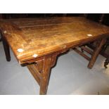 Chinese elm coffee table with shaped frieze and splay supports with stretchers