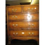 Reproduction mahogany dwarf chest of two short and three long drawers with splay supports