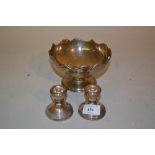 Small silver leaf form dish and a pair of silver dwarf candlesticks