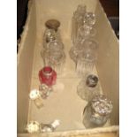 Five early 20th Century silver mounted cut glass perfume bottles and four clear cut glass perfume