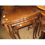 Nest of three walnut occasional tables and an oak three tier circular folding cake stand