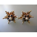 Pair of 9ct gold sapphire and pearl set ear studs in sunburst design mounts