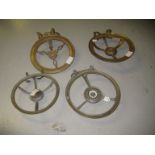 Group of four various 19th Century brass ring stands or trivets