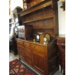 George III oak and pine dresser with a boarded shelf back above three small drawers with three