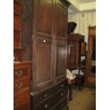 George III mahogany linen press, the moulded cornice above two panelled doors enclosing slides