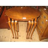 Nest of three oval walnut occasional tables on cabriole supports