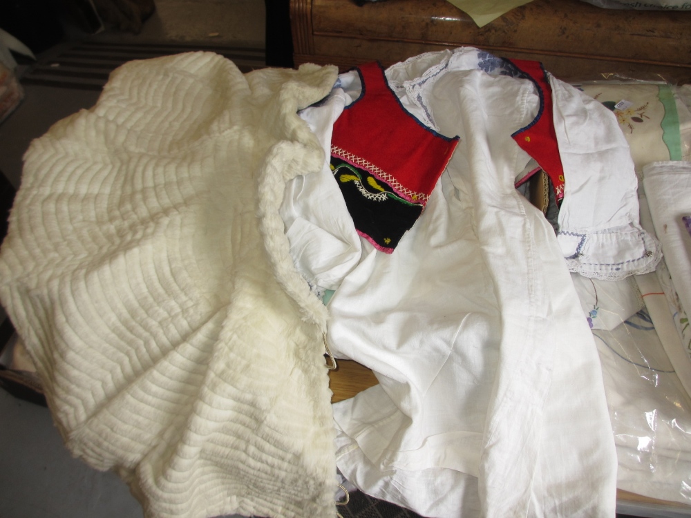 Miscellaneous textiles to include: fur cape, collars, table linen, Christening gown etc