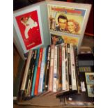 Box containing a quantity of various film books and five scrapbooks of prints of movie posters etc