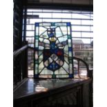 Antique stained and coloured glass panel of a coat of arms