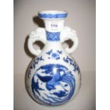 20th Century Chinese blue and white dragon and phoenix decorated vase with dragon form handles