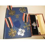 Group of six various German World War II medals and a copy of Mein Kampf in English