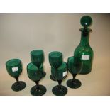 Early 19th Century green glass decanter, together with six similar goblets