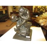 Bronzed metal figure of a monkey seated on books, contemplating a skull, entitled ' Darwin ', 12ins