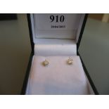 Pair of 18ct yellow gold diamond solitaire stud earrings, approximately 0.31ct