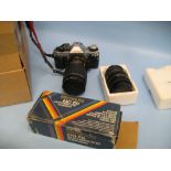 Canon AE1 35mm camera with additional lens and flash gun