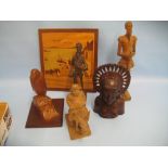 Balinese hardwood carving of a native woman, a Black Forest carving of Don Quixote,