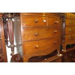 Small Victorian mahogany bow front chest of two short and two long drawers with knob handles,