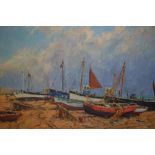 Ernest Knyght, oil on canvas of beached fishing boats, signed,