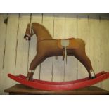 Mid 20th Century fabric covered and painted rocking horse