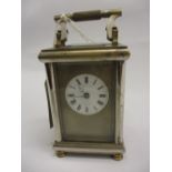 Early 20th Century brass and silvered brass cased carriage clock with circular enamel dial,