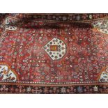 Hamadan rug with medallion and all-over Herati design on red ground with borders,