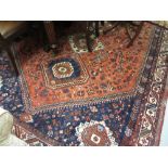 South West Persian style carpet with quadruple medallion and all-over stylised design on a red