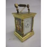 Small modern gilt brass cased carriage clock with enamel dial, Roman numerals,