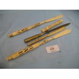 Three late 19th Century carved ivory letter openers with Stanhope viewer inserts together with a