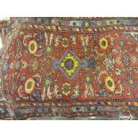 Hamadan rug with medallion and all-over Herati design on a red ground,