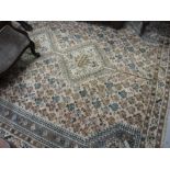 Shiraz carpet with triple pole medallion and all-over stylised floral design on a faded ground with