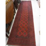 Modern red ground Afghan runner, 2.86m x 0.