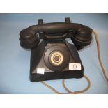 Black Bakelite telephone receiver with press key call button,