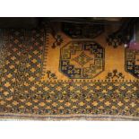 Gold ground Afghan rug with two rows of six gols and multiple borders,