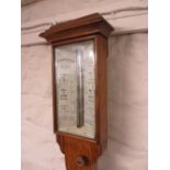 Victorian oak stick barometer, the ivory scale with single adjustable vernier,