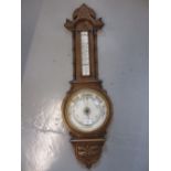 Edwardian carved oak aneroid barometer / thermometer