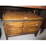 18th / 19th Century pine coffer bach, the plank lid above four fielded panels,