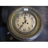 Late 19th or early 20th Century circular brass framed wall clock with two train movement