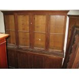 Large Victorian pitch pine bookcase with two pairs of glazed panelled doors above two pairs of