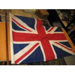 Large Union flag on a brass mounted mahogany staff