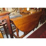 18th Century oak oval gateleg dining table on turned supports with moulded stretchers