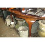 Early 20th Century mahogany oval pull-out extending dining table with a single extra leaf on