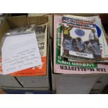 Two boxes containing a quantity of football programmes and memorabilia including photographs etc